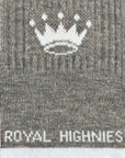 Close-up of a knit sock in heather gray with a white crown motif near the top and the words 'ROYAL HIGHNIES' in white at the bottom.