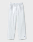 White lounge pants with an elastic waistband and a small navy embroidered crown logo near the lower left hem, shown against a light gray background.