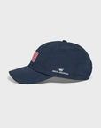 A navy baseball cap featuring an American flag patch on the front and the Royal Highnies logo embroidered in white on the side.