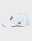 A white baseball cap featuring an embroidered American flag patch on the front and the Royal Highnies logo embroidered in navy on the side.