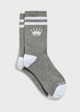 A pair of gray crew socks with white stripes near the top, a white crown logo, and white toe and heel sections.