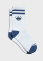 A pair of white crew socks with navy blue stripes, a crown logo, and a navy blue toe and heel, featuring the partial brand name 'ROYAL' on the foot.