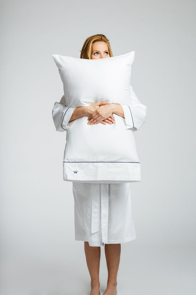 pillow case held by woman