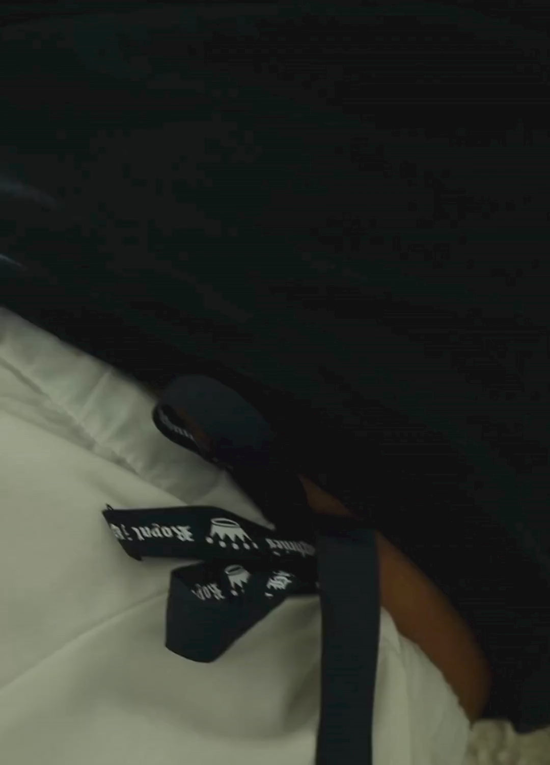 Short video clips showing a woman wearing white pajama pants