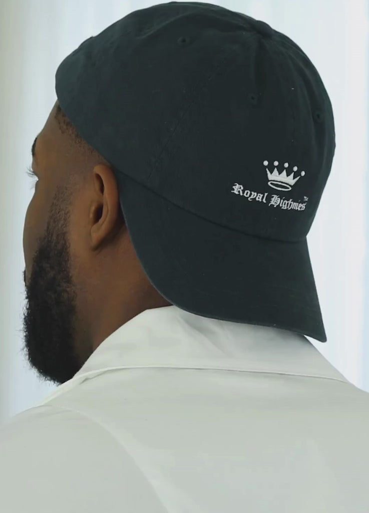 Short video clip showing a man wearing a navy Royal Highnies hat worn backwards.