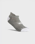 A piece of low-cut ankle socks in heather gray with white toes, heels, and soles, featuring a small white embroidered logo