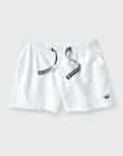 White drawstring shorts with a navy blue embroidered crown logo on the lower left and a matching navy blue drawstring with a brand tag.
